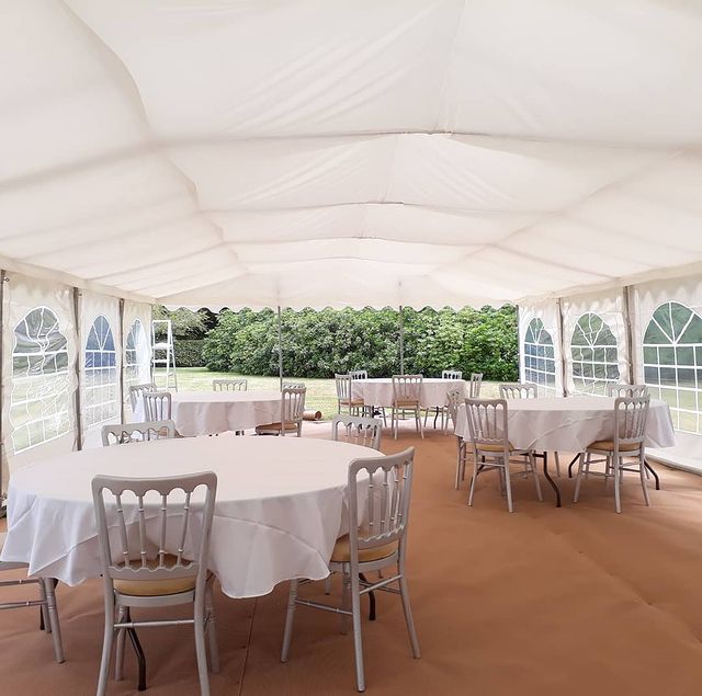 6x12m marquee with ivory roof linings, curtains and honey-beige flooring