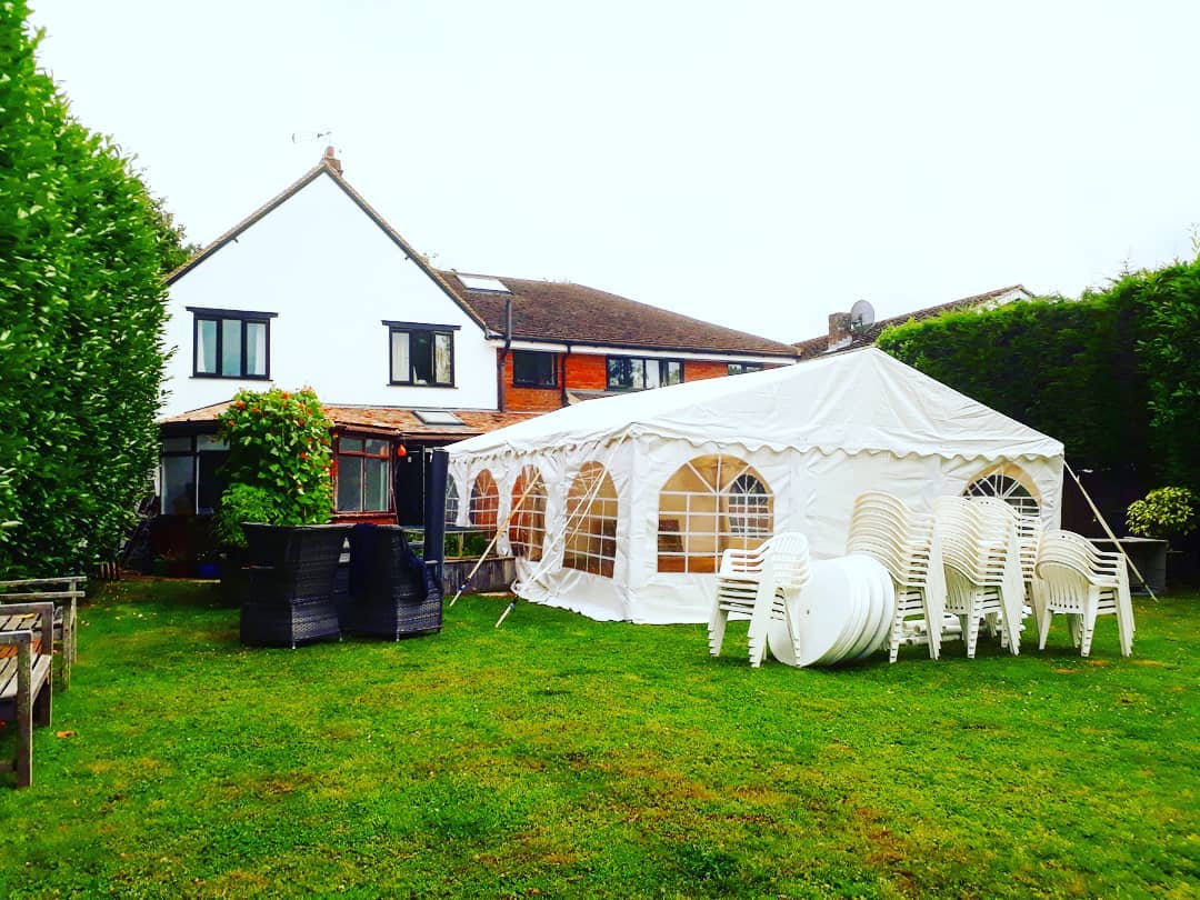6x8m marquee joined to the back of a house with carpet flooring and linings