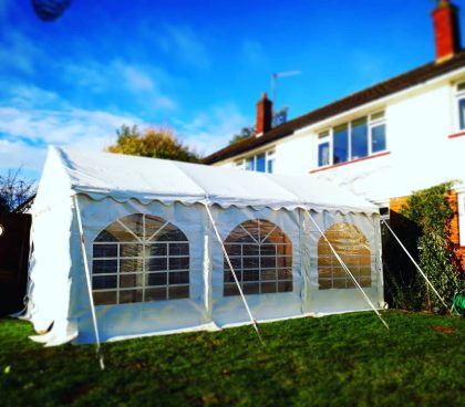 3x6 marquee on connected to the back of a house
